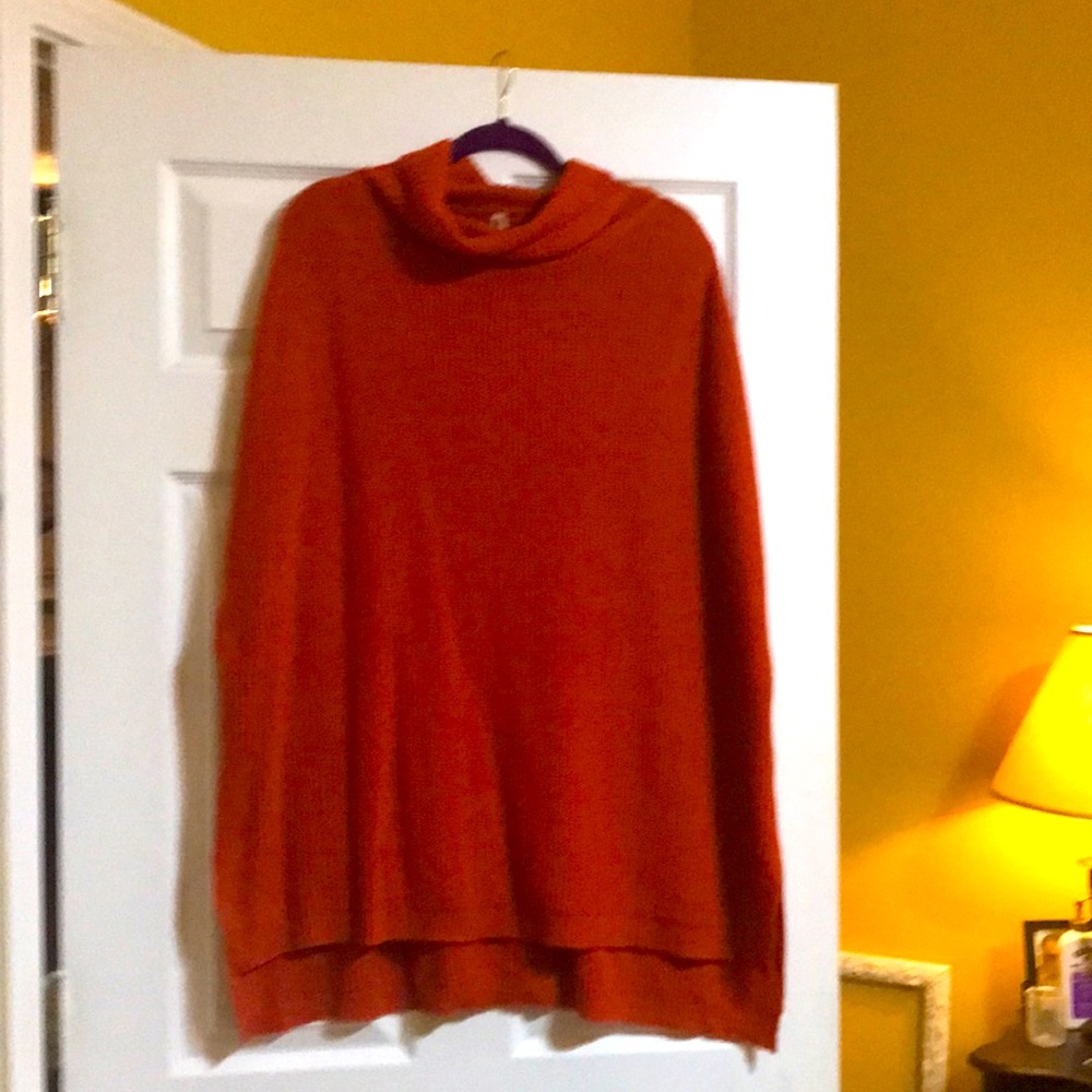 Burnt orange sweater. XL. Never worn. Drop shoulder with slits for the arms.